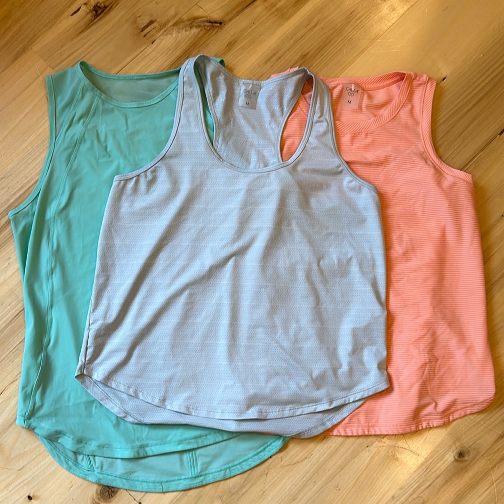 3 ladies workout tank tops size M.